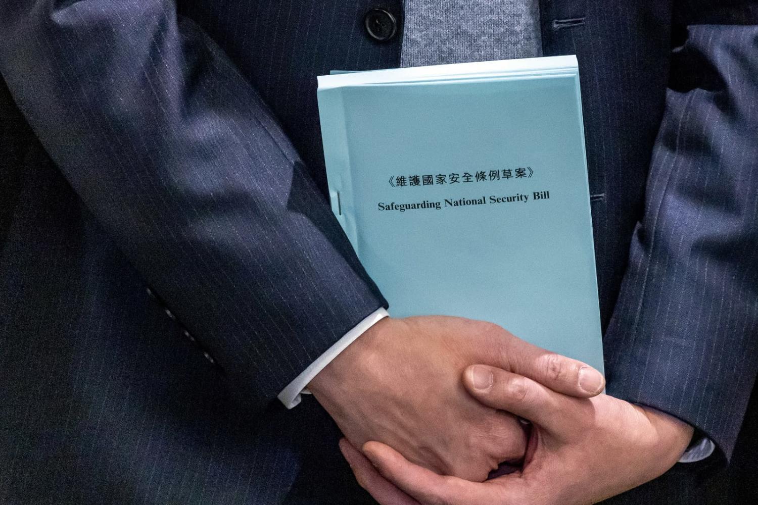 A copy of the proposed Safeguarding National Security Bill after a meeting at the Legislative Council, Hong Kong, 8 March 2024 (Paul Yeung/Getty Images)